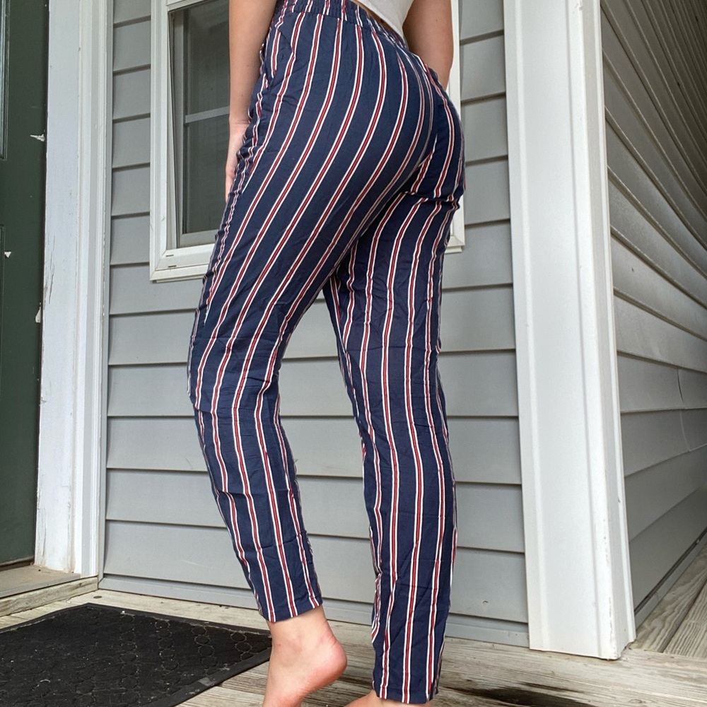 red, white, and blue vertical striped pants
